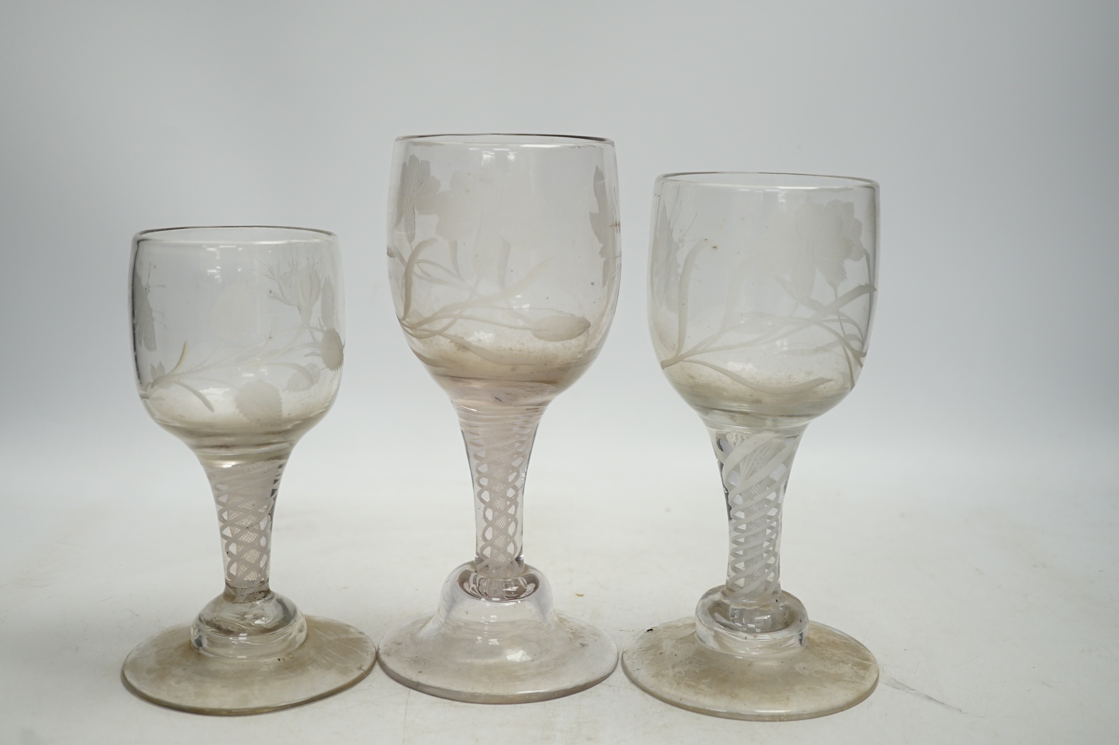 A group of three Dutch engraved wine glasses, in Jacobite style, tallest 19cm. Condition - fair to good, would benefit from a clean